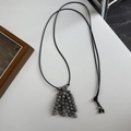 Long beaded tassel necklace featuring black woven cord and grey marble stones - Map Stone Gray