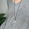 Close-up of a cute silver dachshund dog pendant worn on a black cord necklace - Black Cord and Silver Dog (90cm)