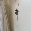 Minimalist silver chain necklace featuring Dalmatian Jasper stones in a vertical drop style - Dalmatian Stone Drawstring Style