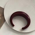 Unique burgundy resin open cuff bracelet with a wide C-shape design and glossy finish - Angola Red Moon Bangle