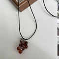 Minimalist grape cluster pendant necklace with translucent reddish brown beads and black cord - Brown Grape Cluster + Black Rope Necklace