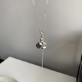 Minimalist silver necklace featuring an irregular molten lava pendant on a cross chain - Thick Silver Tone Hammered Bottle Necklace