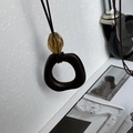 Minimalist long brown resin necklace with amber bead and leather cord variant - Transparent Coffee Irregular Ring (3) / Transparent Coffee