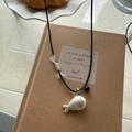 Minimalist silver fish pendant necklace with black cord and white woven tassel knot detail - Matte Silver Fish with Black Cord