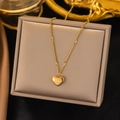 Elegant gold heart pendant necklace with Love engraving and star pattern on jewelry box - Heart Pendant (AH215) / Gold