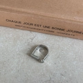 Minimalist silver geometric open ring with bead and bar detail on textured surface - Horseshoe Open Ring