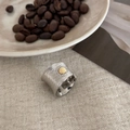 Brushed silver wide band ring with a centered golden circle disc and vintage texture - Contrast Daisy Wide Ring