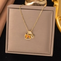 Sparkling zircon Trojan horse pendant necklace with Chinese coin design in golden finish - Pony (8307)