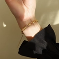 Polished 18k gold-plated thick chain link bracelet with adjustable lobster clasp on wrist - Gold Hollow Round Link Bracelet / Gold