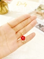 Detailed view of a gold rose necklace with a red flower pendant held in hand - Single Stone Small Flower Style (8337) / Gold