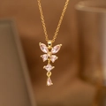 Elegante goldene Schmetterlingshalskette mit rosa facettierten Zirkonia und Kristallen - Schmetterling Quaste Halskette mit rosa Zirkonia (9187)