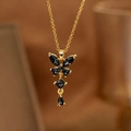Elegante Halskette mit Schmetterlingsanhänger, schwarzen Kristallen und Goldquasten - Schmetterling Quaste Halskette mit schwarzem Zirkonia (9189)