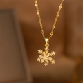 Elegant gold snowflake pendant necklace with sparkling cubic zirconia on a delicate chain - Rotating Snowflake Style (9208) / Gold