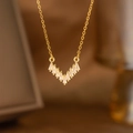 Detail of V-shaped gold necklace featuring rectangular cut sparkling cubic zirconia - Full Zirconia V Style (9159)