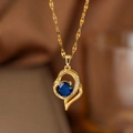 Gold heart pendant necklace with micro-pave crystals and a central deep blue zircon stone - Blue Zircon Heart (9143) / Gold