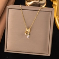 Golden necklace with pink rectangular gemstone and sparkling zircon ring pendants - Geometric Pink Diamond Style (8287)