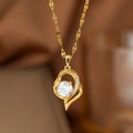 Close-up of gold heart necklace with asymmetric swirl and micro-pave cubic zirconia stone - White Zirconia Heart (9144) / Gold