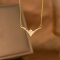 Macro shot of gold V-shaped laurel pendant with square zircon and pave setting detail - V-Shaped Rhombus Diamond (9170)
