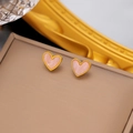 Golden titanium heart earrings with pink marble inlay displayed on a leather case - Pink Heart / Gold