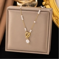 Gold OT clasp necklace with small white beads and a baroque pearl pendant on leather - 57cm Pearl (H6112) / Gold
