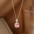 Macro detail of gold pendant necklace with square pink gemstone and pavé accents - Pink Gemstone Style(9284)