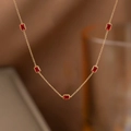 Luxurious gold titanium necklace featuring five elegant emerald-cut red zircon pendants - Necklace / Five Red Stones Necklace (Gold)