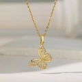 Close-up of a gold butterfly pendant with sparkling white diamonds on a delicate chain - Pave Hollow Butterfly (Gold)