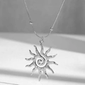 Silver tone sun pendant necklace with spiral pattern on sleek snake chain - Sun Necklace (H35)