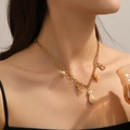 Gold ocean themed necklace for women with seahorse and seashell charms on link chain - Necklace