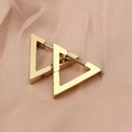 Macro shot of minimalist gold geometric triangle hoop earrings on champagne silk fabric - Triangle Style