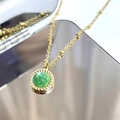 Detail of 14K gold plated necklace with green faceted stone and twisted pendant border - African Jade