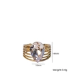 Golden multi-layer open ring featuring a 10x14mm pear-shaped clear natural stone - White