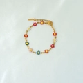 Detail showing colorful enamel daisies on a gold-plated adjustable chain bracelet - Multicolor Bracelet