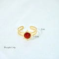Detailed macro view of gold-plated stainless steel ring with red stone and dimensions - Red Agate Style