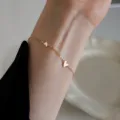 Elegant gold stainless steel link bracelet with small solid heart charms for women - Three Hearts Bracelet (5579)