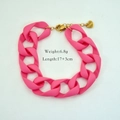 Detailed close-up of pink acrylic chain bracelet with stainless steel heart charm - Rose Red