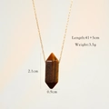 Detail view of tiger eye stone pendant with size labels 2.1cm by 0.9cm on golden chain - Tiger Eye