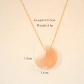 Detail of pink crystal moon pendant on a gold chain with precise dimensions and weight - Sunstone