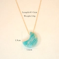 Detail shot of blue moonstone crescent necklace with 41+5cm chain and 3.4g weight - Amazonite