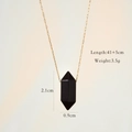 Detailed shot of a black hexagonal stone pendant with gold paperclip chain and measurements - Black Agate
