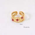 Detailed macro view of 9mm wide triple-layered gold open ring with red stones - Rhodonite