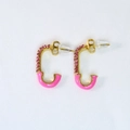 Detail of gold C-shaped earrings with pink rhinestones and enamel on white fabric - Safety Pin Stud Earrings / Pink