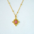 Detailed view of vintage gold necklace featuring a pink oval gemstone and bead chain - Necklace / Rhodochrosite Necklace