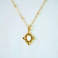 Close-up of vintage 14k gold satellite chain necklace with milky white opal pendant - White Jade Necklace