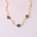 Detail of gold zigzag chain with blue and green beaded flower charms for women - African Pine Flower