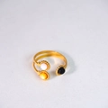 Detail of 14K gold plated stainless steel open ring with white, yellow, and black shells - Double Loop Open Style (Style 2)