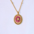 Detail of bohemian gold star pendant featuring an oval pink natural stone inlay - Gold-Rhodochrosite Necklace