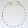 Detail of light blue natural stone beads on a golden stainless steel chain with lobster clasp - Sky Blue Natural Stone (5)