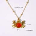 Golden crab pendant necklace with red cabochon stone and starfish maritime theme - Red Agate Crab Necklace