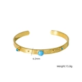Brazalete de acero dorado con piedra turquesa y detalles de cristales azules - Azul Turquesa